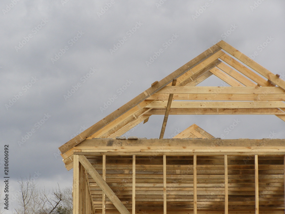 The frame of a wooden house against the sky The frame of a wooden house against the sky