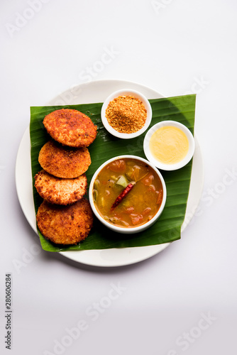 Podi idli is a quick and easy snack made with leftover idly. served with sambar and coconut chutney. selective focus