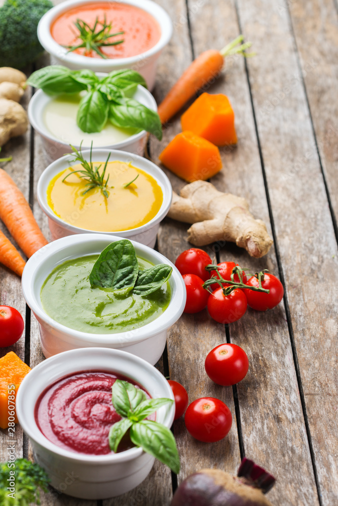Set of seasonal fall autumn creamy soups on a table Set of seasonal fall autumn creamy soups on a table