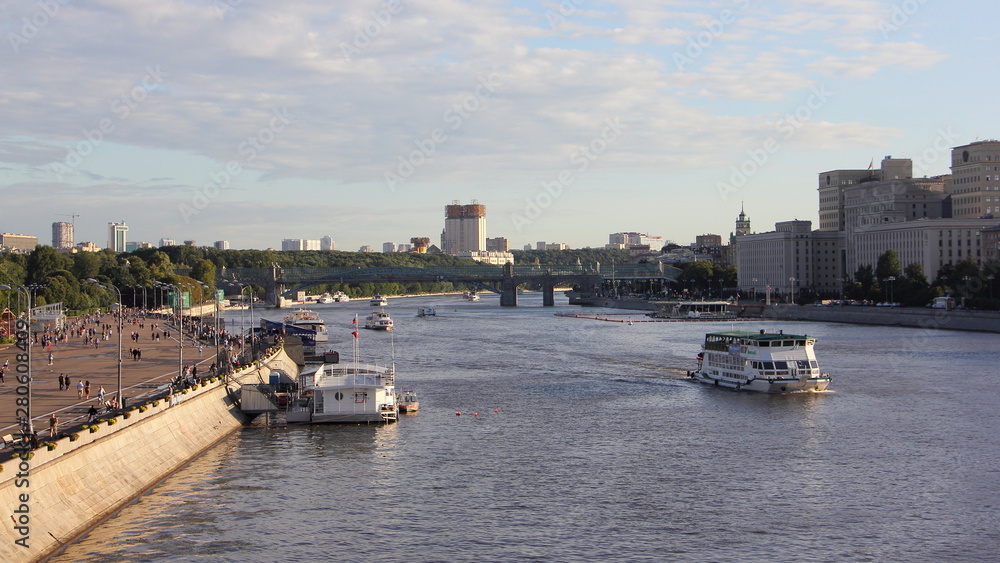 Top view of Moscow river with ships, Pushkin embankment and Andrew's bridge in Gorky Park on a Sunny summer day against the blue sky