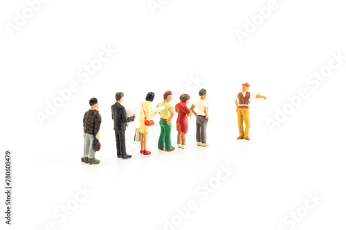 Miniature People Standing in a Line, Waiting
