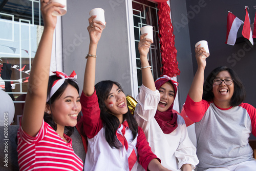 happy indonesian youth celebrating national independence day with friends photo