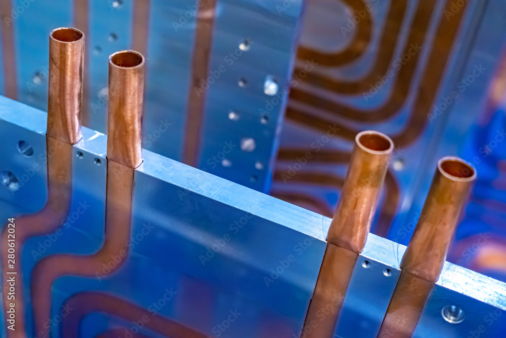 Copper tubes tubes built into the metal plate. Cooling system with ...