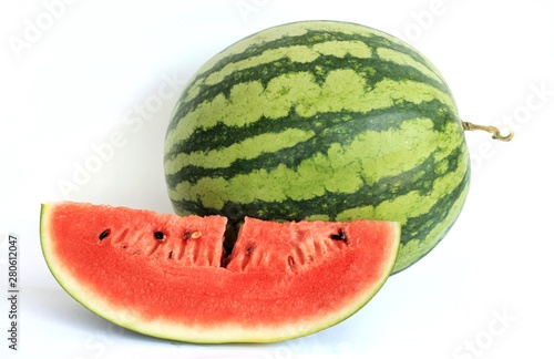 Whole of Watermelon (Citrullus lanatus) and its sliced on white background.Watermelon is very juicy,so sweet but low sugar.Have a lot of vitamins and minerals.Fruit or healthcare concept.