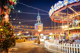 Moscow, Russia, Kremlin and Red square. Christmas celebration. Christmas market. New year fair. Festive illumination. Decorated city. Christmas tree and carousel. Evening capital of Russia