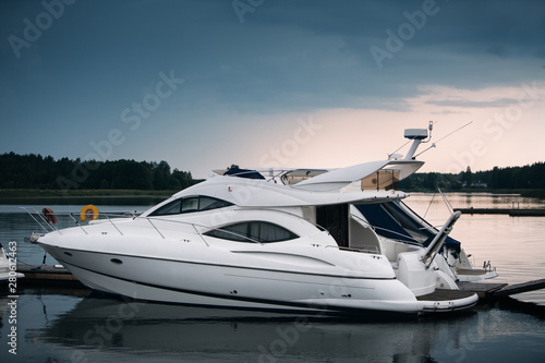 Modern motor boats and yachts docked in sea port