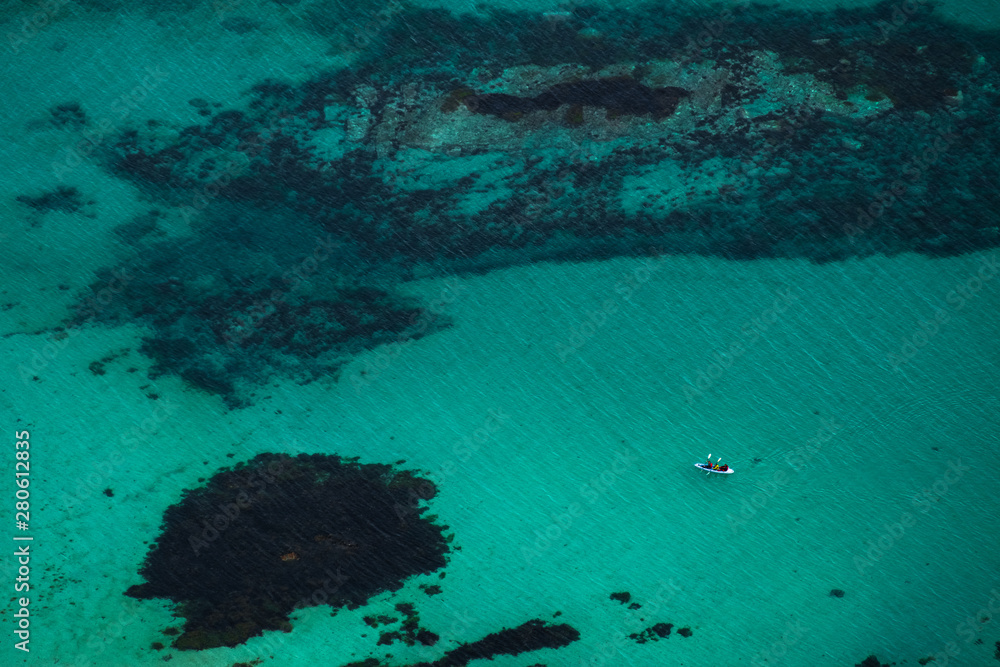 aerial view of kayak and turquoise water