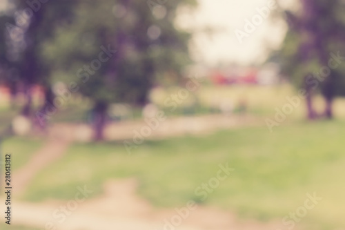 Abstract blurred background of city park in sunny day.