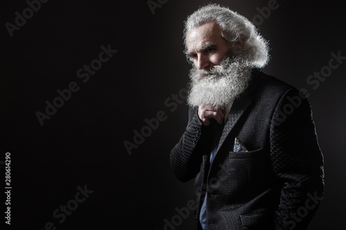 A man with white hair. The ...