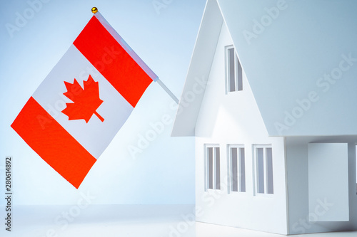White cottage with flag. Ho...