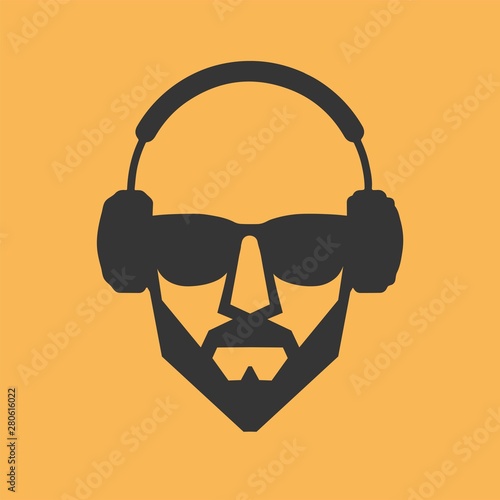 Man with a beard wearing glasses and headphones 