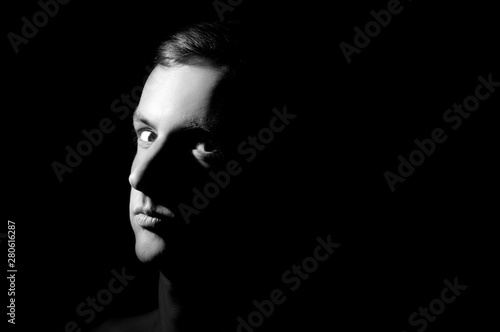 black and white photo, large portrait half face lit © Serhii  Holdin