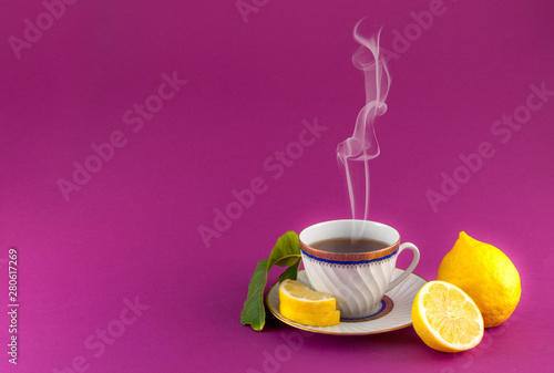 Fototapeta Naklejka Na Ścianę i Meble -  Tea cup on colored background