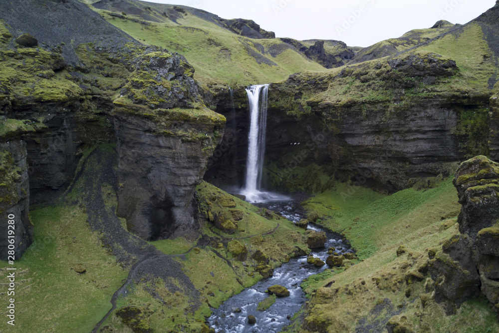 The fall is in the river Kverná tracing its origin to the south slopes of Eyjafjallajokull, and the gorge also bears the name Kvernugorge or Kvernugil. The fall is in the river Kverná tracing its origin to the south slopes of Eyjafjallajokull, and the gorge also bears the name Kvernugorge or Kvernugil.