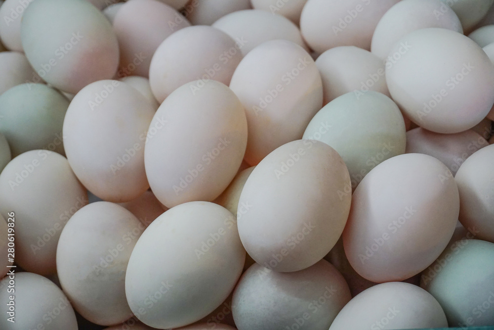 Fresh dirty duck eggs from farm for wholesale at egg market.