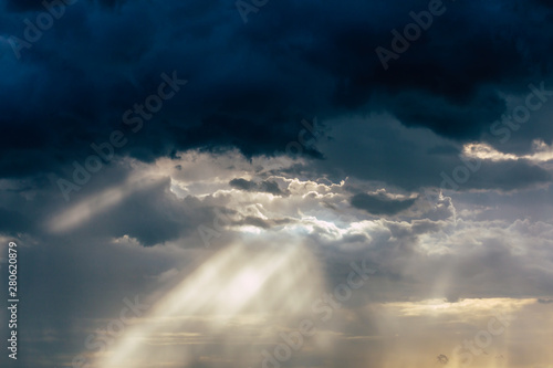 The sky and the black clouds and the sunshine through © NARANAT STUDIO