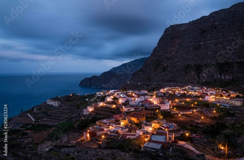 Village of Agulo at night, at  back steep coast Agulo, La Gomera, Canary Islands, Spain, Europe photo