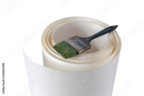  White paper roll and work paint brush on white background