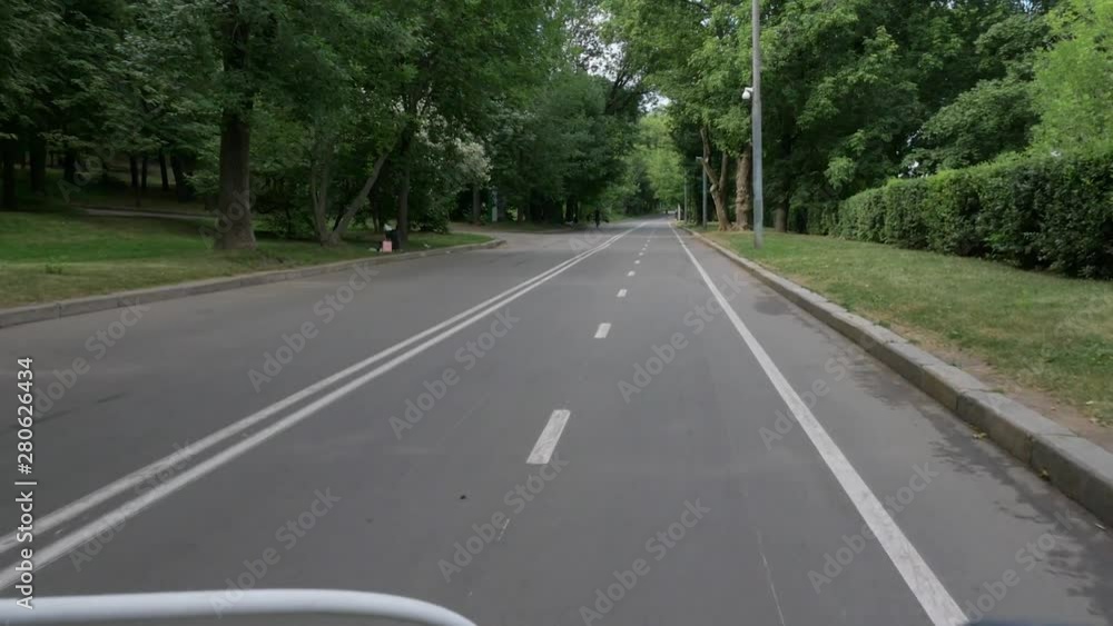 handlebars and bicycle front wheel speeding along road handlebars and bicycle front wheel speeding along road