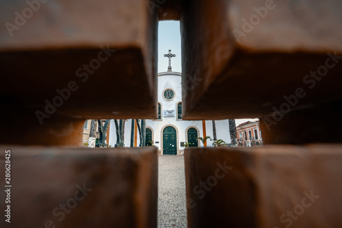 Picture of church taken through the brick hole, Angola