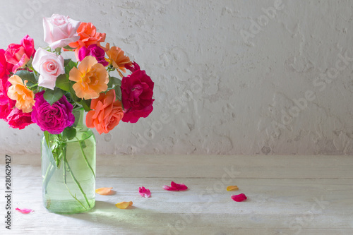 roses in vase on background...