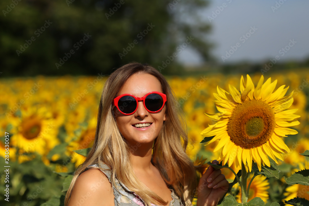 Cute girl in the field full of sunflowers Cute girl in the field full of sunflowers