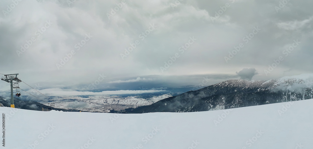 Bansko resort panoramic view with ski slope, view from the top of the mountain, Bulgaria.