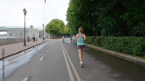 Wallpaper Mural sporty girl in a blue t-shirt doing a jog on the waterfront Torontodigital.ca