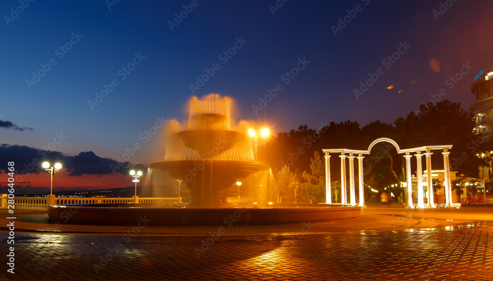 Singing fountain on the promenade of Gelendzhik at sunset.