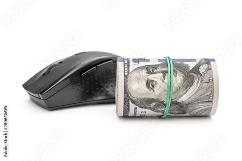 Computer mouse with rolled up dollars on white.