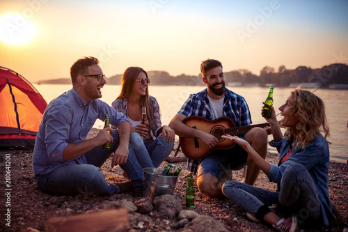 Group of cheerful young friends having fun together photo