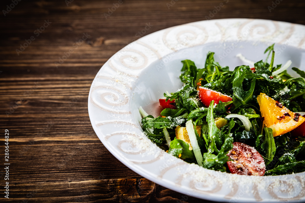 Greek salad on wooden background Greek salad on wooden background