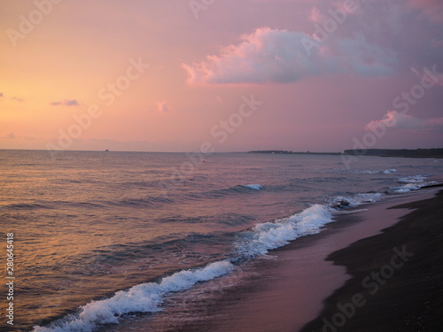 picturesque Pink sunset on lake beach sea sand beautiful colors in the sky clouds