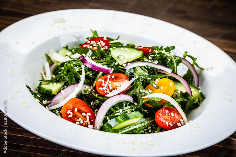 Greek salad on wooden background Greek salad on wooden background