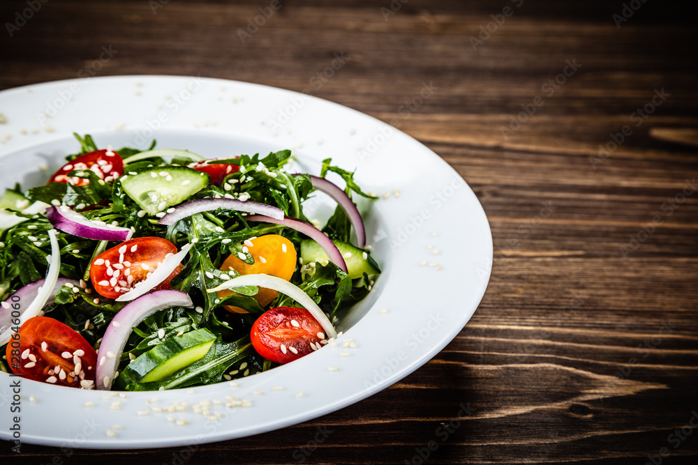 Greek salad on wooden background Greek salad on wooden background