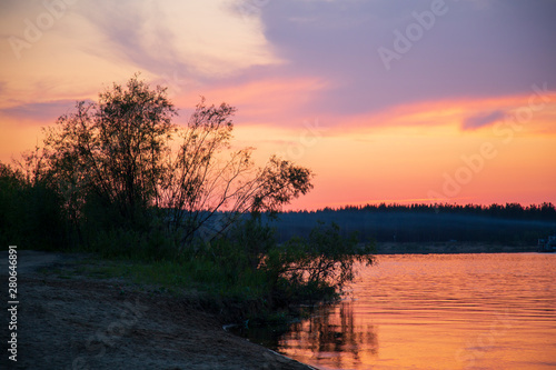 Beautiful summer landscape with sunset on the river.