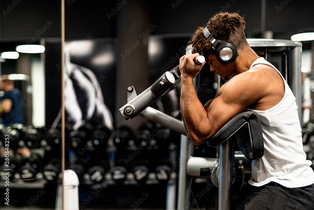 Young afro man training in the gym Young afro man training in the gym