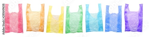Plastic rainbow packs are isolated on a white background. Environmental pollution by disposable bags, recycling