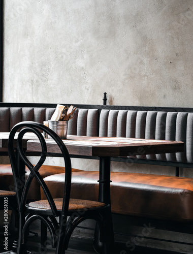 Dark colored interior of cafe with shabby wall