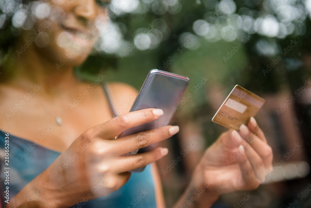 Woman online shopping on mobile phone Woman online shopping on mobile phone