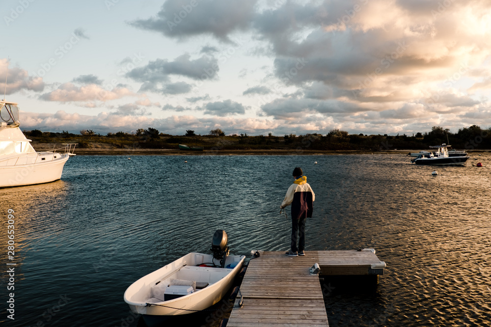 teenage boy fishing bu the sea teenage boy fishing bu the sea