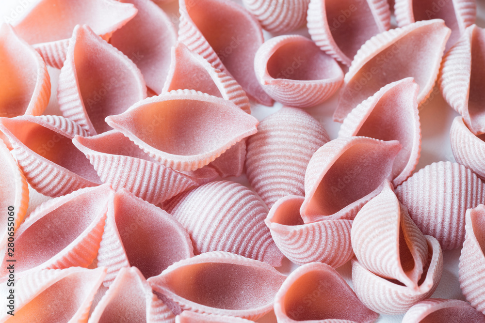 heap pink shell pasta called conchiglie, for pattern or texture heap pink shell pasta called conchiglie, for pattern or texture
