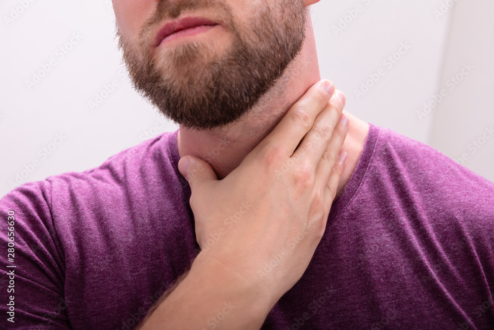 Fototapeta premium Young Beard Man Having Throat Pain