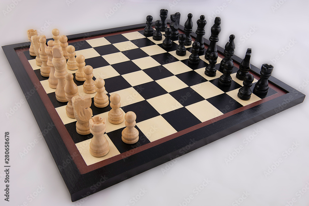 Chess board and game pieces in position to start Chess board and game pieces in position to start