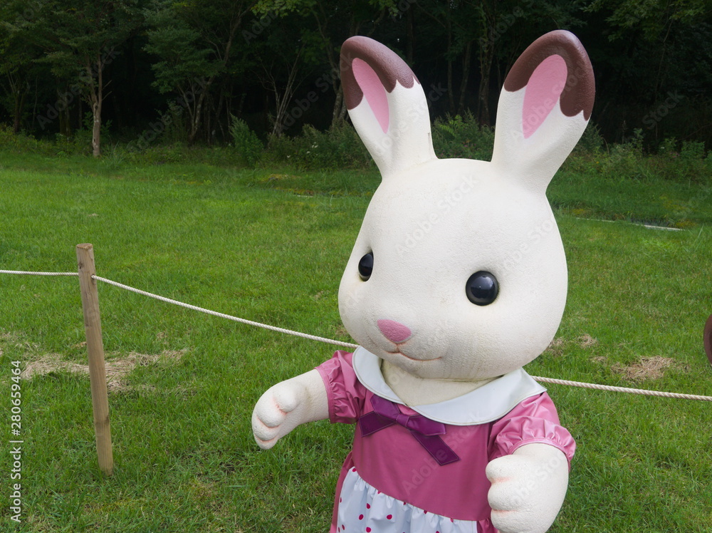 easter bunny with eggs in green grass