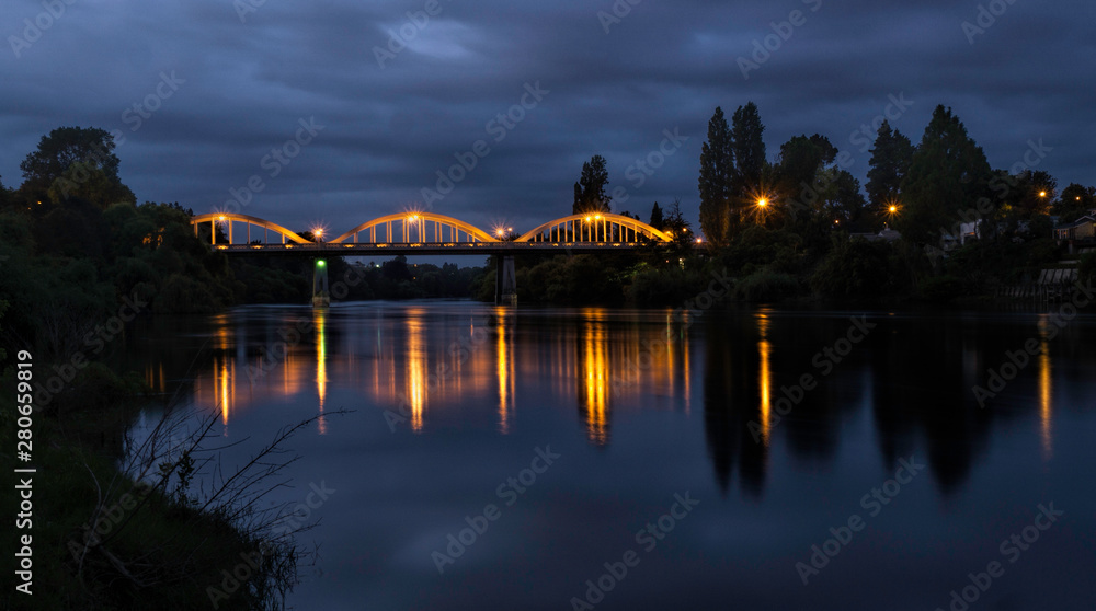 Fairfield bridge  lit up at night on the Waikato River of Hamilton city, New Zealand 