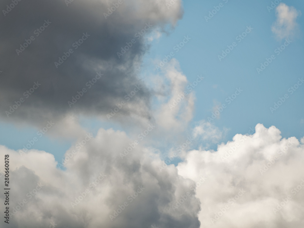 The sky with beautiful cumulus clouds. Restrained pastel colors. The sky with beautiful cumulus clouds. Restrained pastel colors.