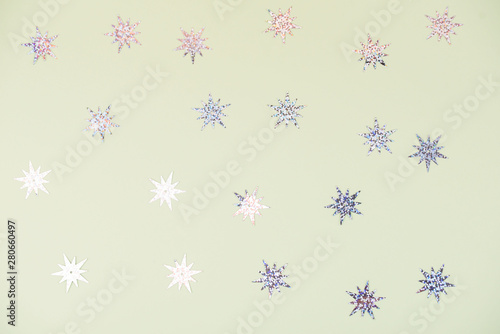 Christmas frame with gold snowflakes. Border of sequin confetti. Glitter powder sparkling background