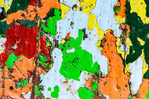 park benches with worn paint forming different colors, textures and shapes painting photography