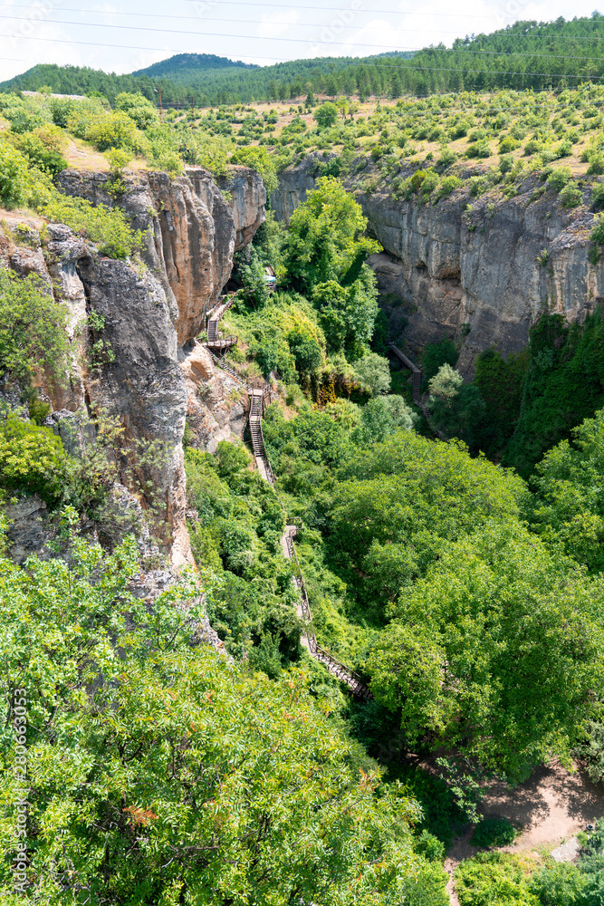 Panoramic view of Incekaya Canyon from Kristal Cam Teras, Safranbolu Karabuk, Turkey. Wooden staircases in Incekaya Canyon